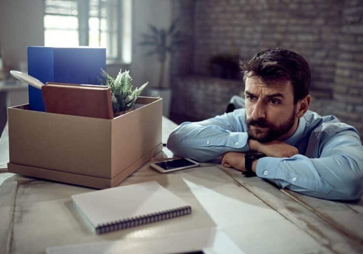 young-businessman-feeling-worried-about-losing-his-job-thinking-something-office